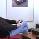 A young Blackley seen playing an Xbox in his office.